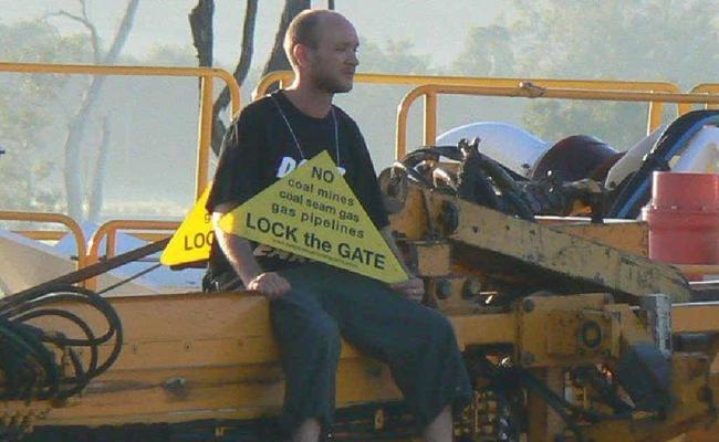 A protester on a drilling rig at Silverdale Plains. . Picture: Contributed