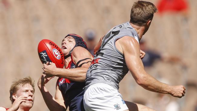 Angus Brayshaw of the Demons takes a contested mark under pressure from Port co-captain Tom Jonas. Picture: AAP Image/Daniel Pockett