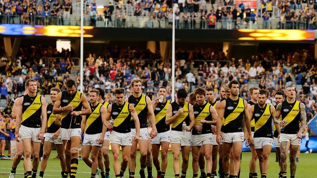 The Richmond Tigers leave the field after losing to the West Coast Eagles in Perth.