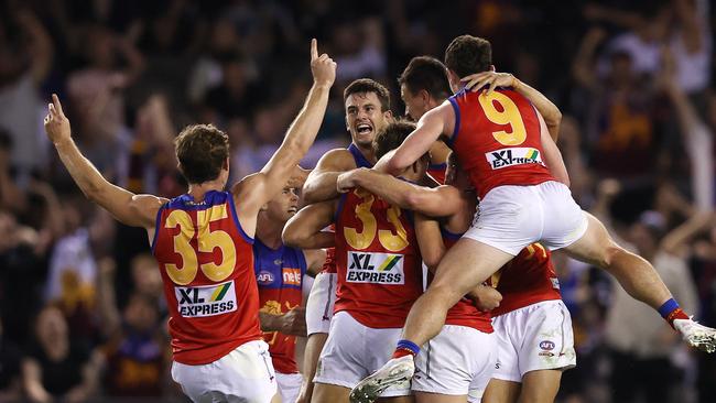 Brisbane players come from everywhere to celebrate with Zac Bailey. Picture: Michael Klein