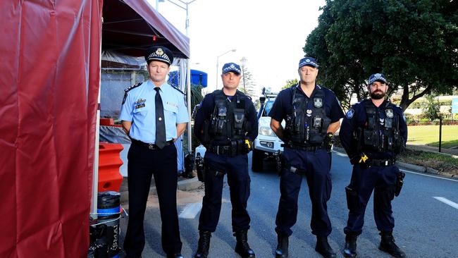 Super Intendant Mark Wheeler with his fellow Queensland Police officers re enact a photo from 1919 when the QLD/NSW Border was closed due to the Spanish flu. Picture Scott Powick