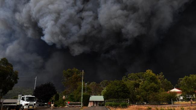 The Green Wattle Creek blaze will be affected by conditions on Saturday in greater Sydney and Illawarra-Shoalhaven, with more lives and homes in peril. Picture: AAP