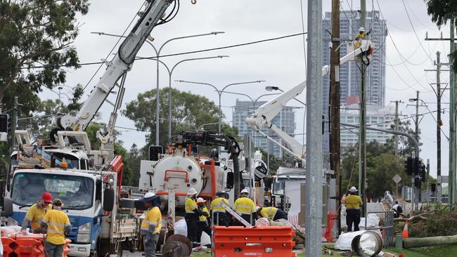 Energex workers get on with recovery efforts outside HOTA and Bundall. Picture Glenn Hampson