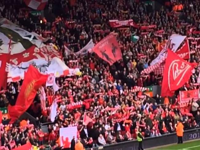 Liverpool fans on the Kop singing You'll Never Walk Alone