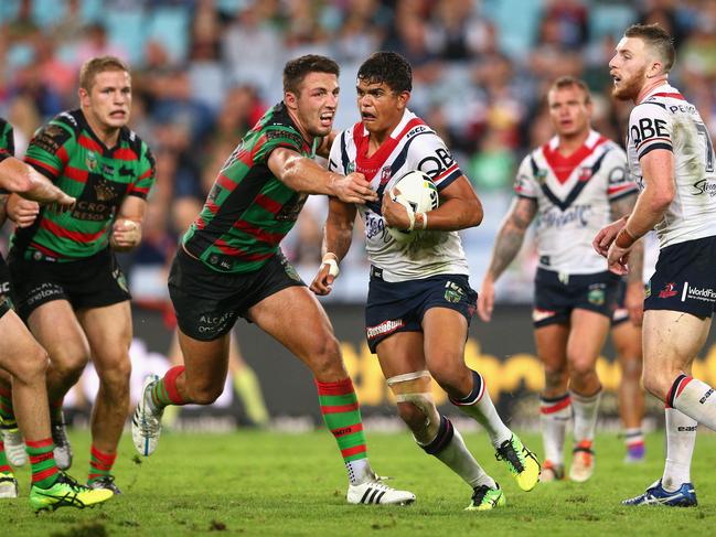 SYDNEY, AUSTRALIA - APRIL 08: Latrell Mitchell of the Roosters is tackled during the round six NRL match between the South Sydney Rabbitohs and the Sydney Roosters at ANZ Stadium on April 8, 2016 in Sydney, Australia. (Photo by Cameron Spencer/Getty Images)