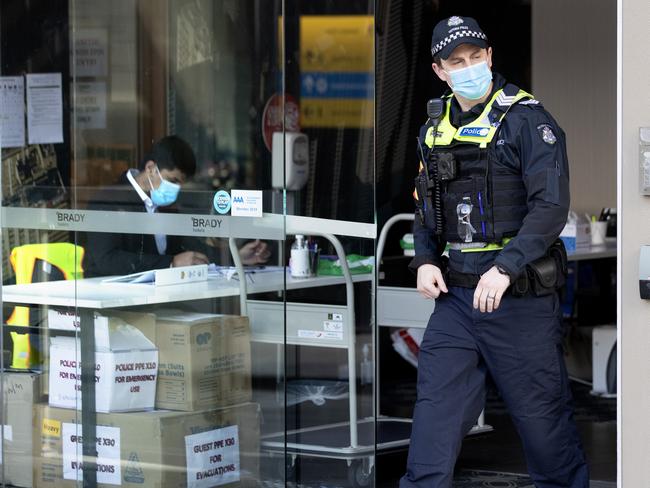 MELBOURNE AUSTRALIA - NewsWire Photos AUGUST 21, 2020: A protective service officer leaves the Brady Hotel in Melbourne CBD on Friday morning. The hotel has been given the contract to act as a Covid 19 quarantine centrePicture: NCA NewsWire / David Geraghty