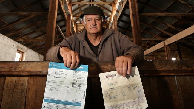 Meredith farmer Adrian Mohr with his bills: More than two million Victorians will soon be receiving their household rates bill for this financial year. Picture: Yuri Kouzmin