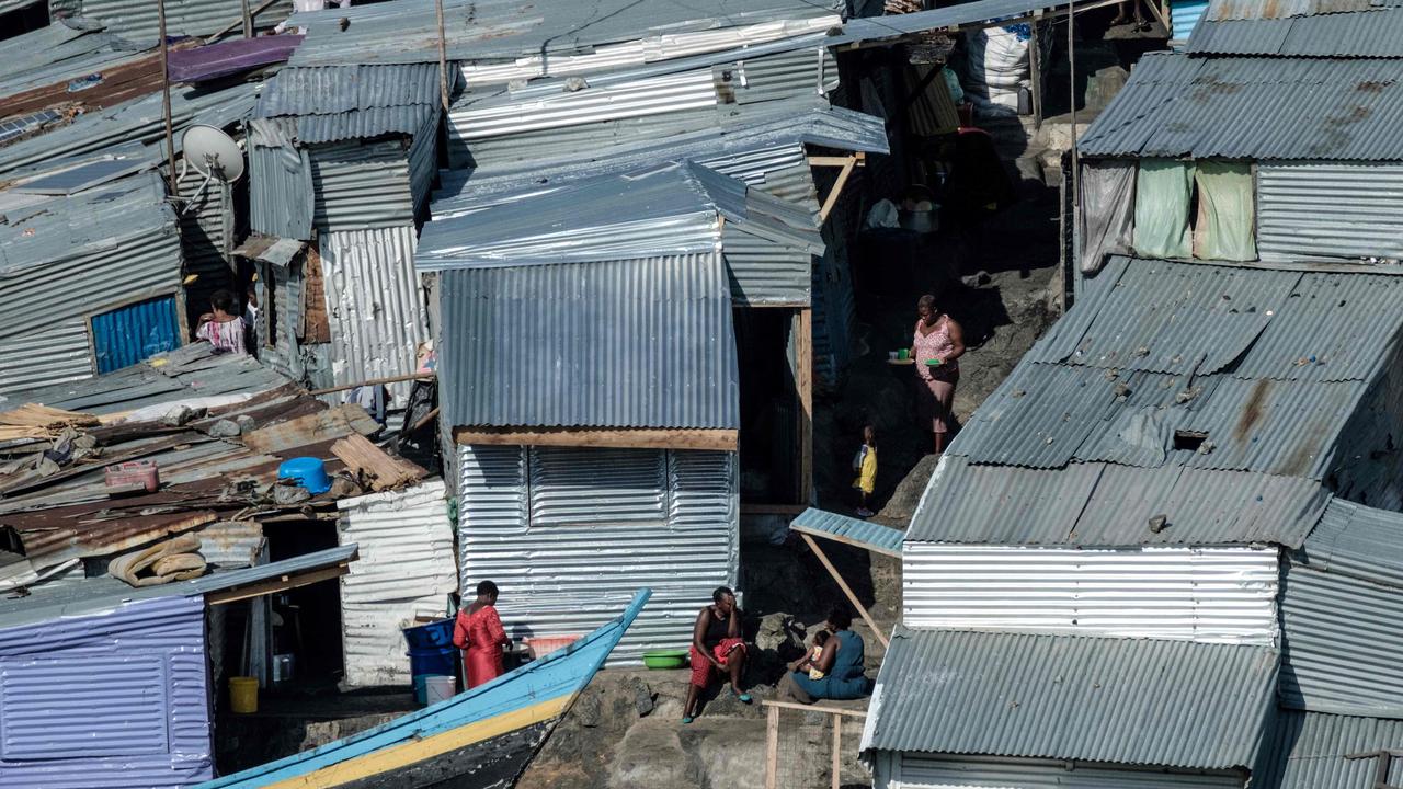 Residents are crammed into a hodgepodge of corrugated-iron homes, with seemingly little but a few bars, brothels and a tiny port. Picture: Yasuyoshi Chiba/AFP