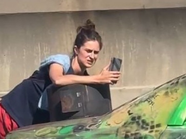 A protester is chained to a car on the Montague St exit ramp. Picture: Supplied