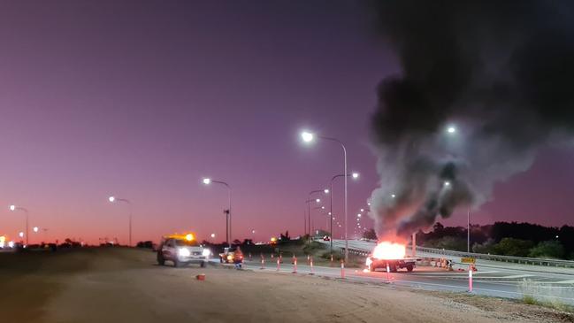 Burning ute on Townsville Ring Road. Picture: Tidy Towing