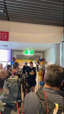 Fans Greet Premiership Lions at Brisbane Airport