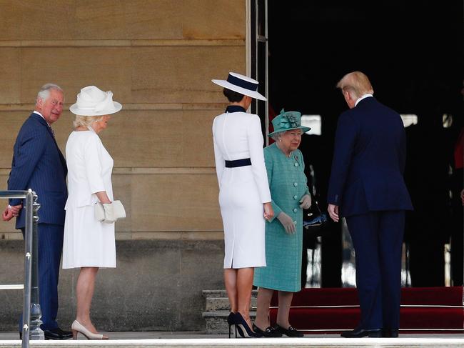 The Queen greets US President Donald Trump and his wife Melania during a welcome ceremony at Buckingham Palace. Picture: AFP