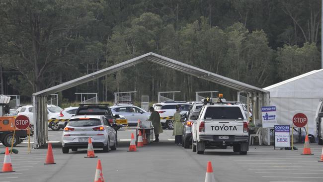 The carpark at C.ex Stadium is filled with vehicles queuing at the drive-through Covid testing clinic in Coffs Harbour in July. Photo: Tim Jarrett