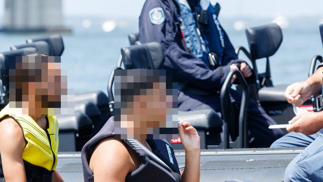 A jet ski driver swabbing his tongue in a random drug test by police on the Georges River at Sans Souci on the weekend. The tests came back clear and the driver was doing everything correctly and left to go about his day. Picture: Max Mason-Hubers