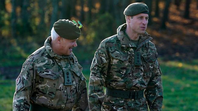 The royal spent time talking with the soldiers. Picture: AFP