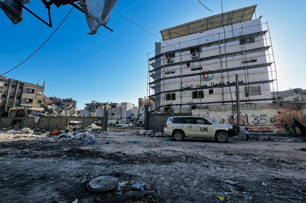 UN-marked vehicles are parked at the Kamal Adwan Hospital in Beit Lahia in the northern Gaza Strip as medics evacuate injured people and cancer patients