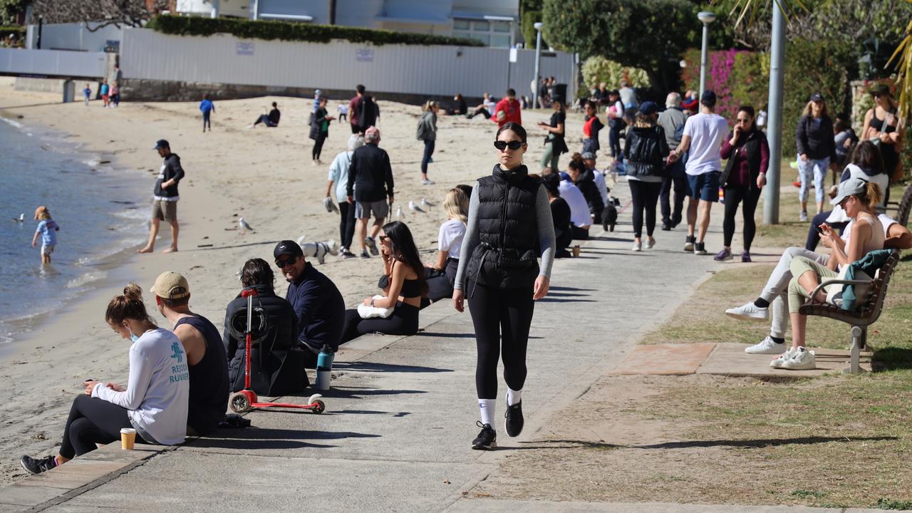 Beach-goers make the most of the winter sun during lockdown at Double Bay in Sydney on Saturday. Picture: Nicholas Eager