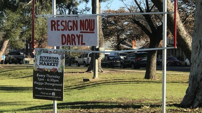 A sign with the text "Resign Now Daryl" on display in Wagga Wagga. Picture: Channel 9