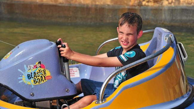 Hayden Gallagher, 8, from Brisbane enjoys the Blaster Boats at Top Shots Fun Park, Maroochydore.Photo: Iain Curry / Sunshine Coast Daily. Picture: Iain Curry