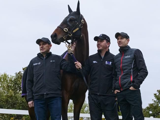 Trainer Chris Waller, strapper Umut Odemislioglu and jockey Hugh Bowman with champion Winx after a trackwork session at Flemington.