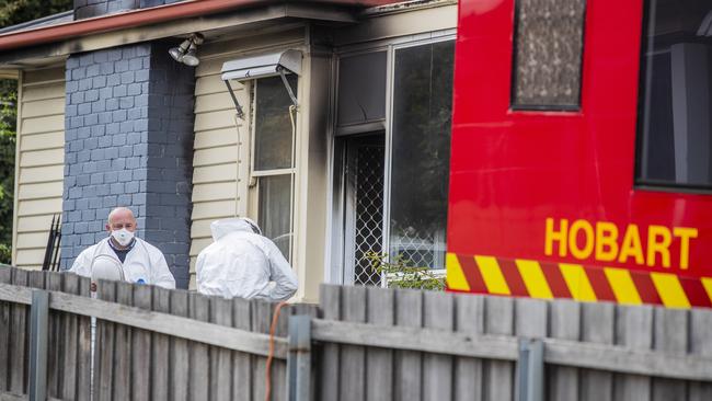 Investigators and Police attend the site of an overnight house fire on Brooker Highway, Lutana. Picture: Richard Jupe