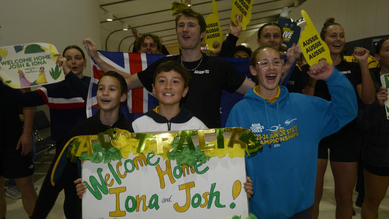 The swimming champions were welcomed by a crowd of friends, family and supporters. Picture: NewsWire / Sharon Smith