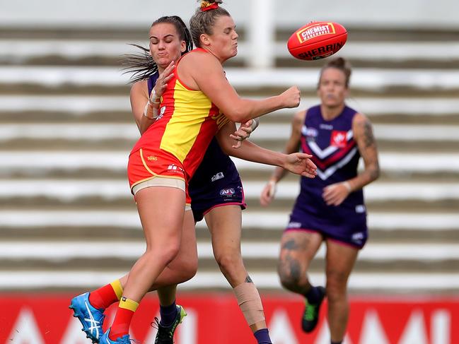 Alice Springs product Jordann Hickey handballs for the Suns against Fremantle on March 21 last year. Picture: Richard Wainwright/AAP Image