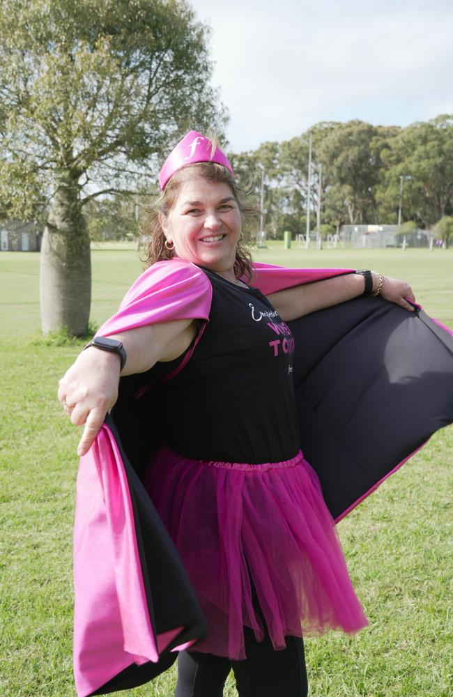 Fernwood Toowoomba's Kathie Long cheers on runners at the Mother's Day Classic Toowoomba fun run at Middle Ridge Park, which raised money for breast and ovarian cancer research.