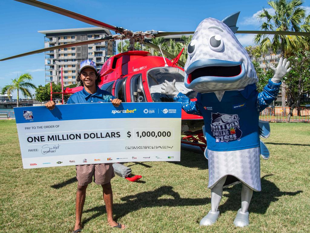 Straight to the pool room: Keegan holds with his giant cheque for a million dollars. Picture: Pema Tamang Pakhrin