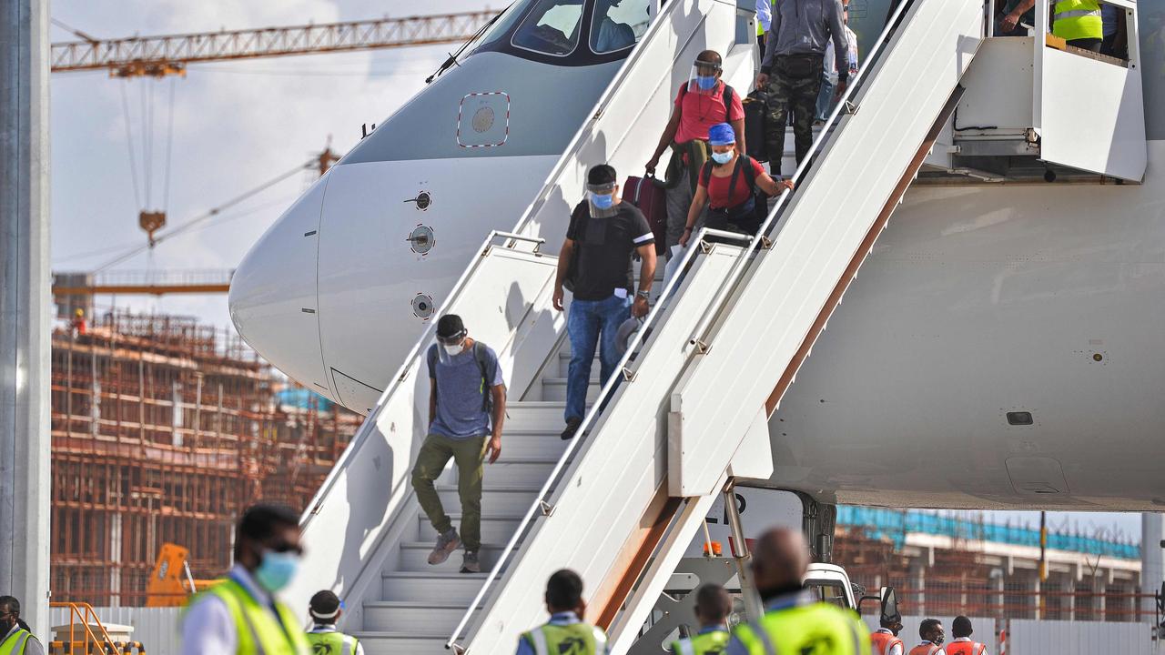 Passengers disembarking a Qatar Airways’ flight via airstairs in Male. Picture: Ahmed Shurau/AFP