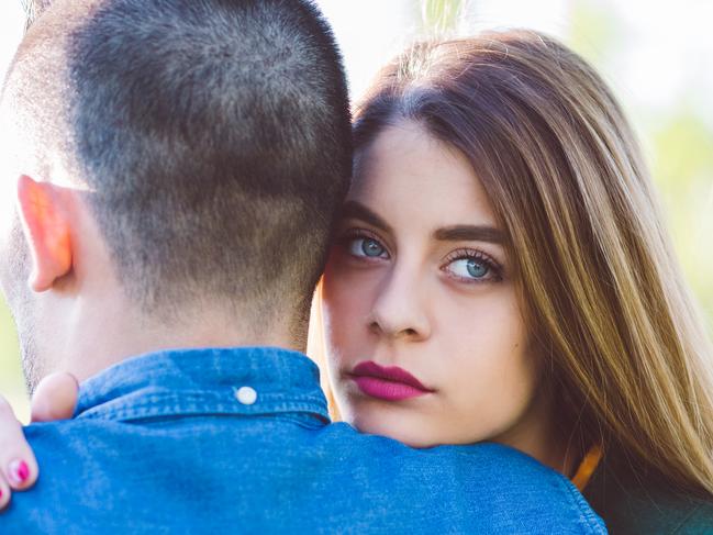 Young woman comforting unhappy friend