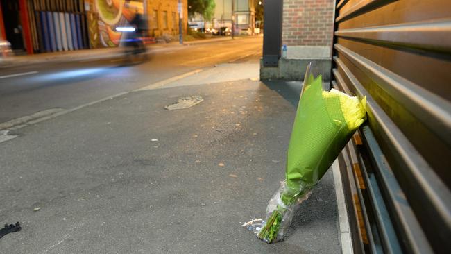 Flowers at the scene of the shooting. Picture: Lawrence Pinder