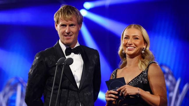 Tennis couple Daria Saville and Luke Saville look on from on stage as they present an award, (Photo by Graham Denholm/Getty Images for Tennis Australia)