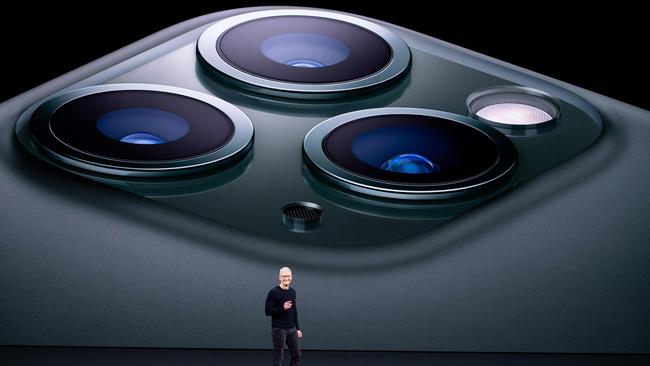 Apple CEO Tim Cook speaks against a backdrop of the phones’ three camera lenses.Picture: AFP.