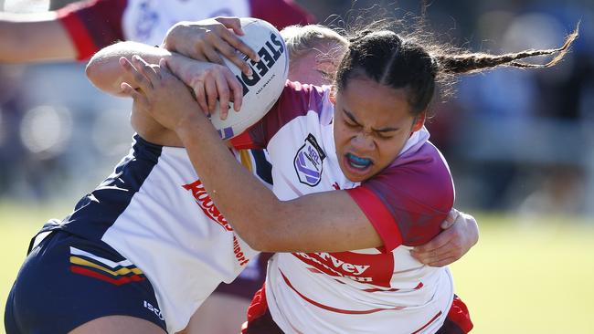 Action from the under-19s women's NRL championships game between Queensland Rubys and South Australia in Miami. Dannii Perese attacks. Picture: Tertius Pickard