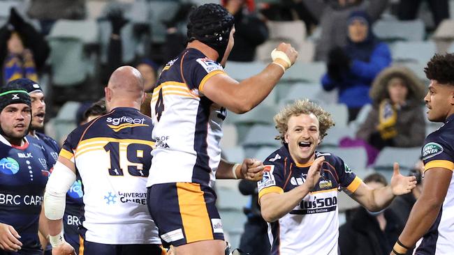 Brumbies’ players celebrate a try in their win against the Rebels. Picture: AFP