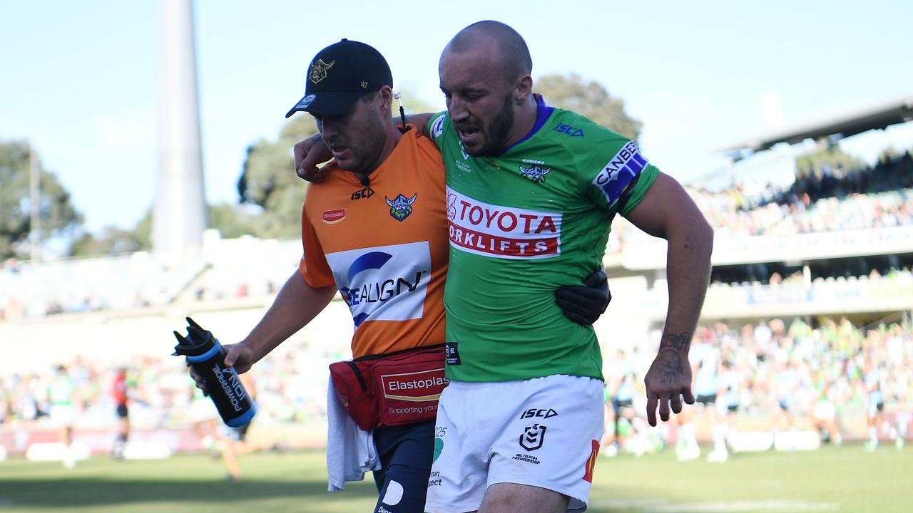 Canberra star Josh Hodgson helped off the field after suffering a knee injury in their season-opening win over Cronulla. Credit: NRL Images.