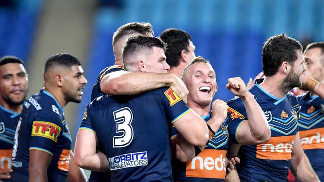 Beau Fermor is congratulated by team mates after scoring a try during the round nine NRL match between the Gold Coast Titans and the New Zealand Warriors. Photo: Bradley Kanaris/Getty Images