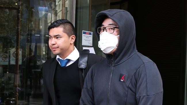 Justin Ly (right) leaves Downing Centre Local Court. Picture: Gaye Gerard