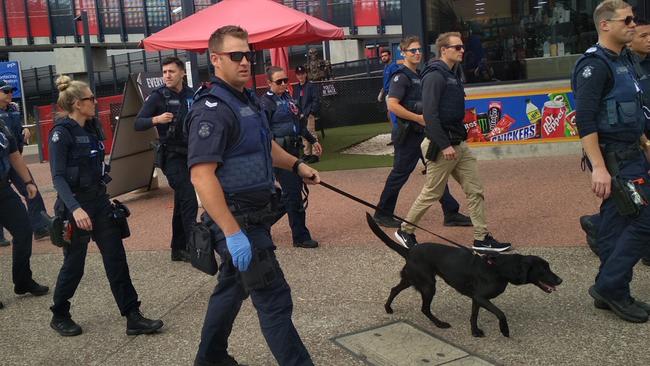 Acting senior sergeant Travis Costelow leads a group of officers to Footscray cbd.