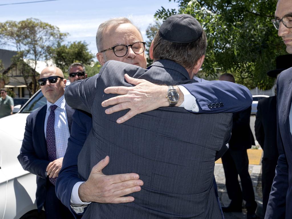 The Prime Minister hugs a member of the Jewish community. Picture: David Geraghty