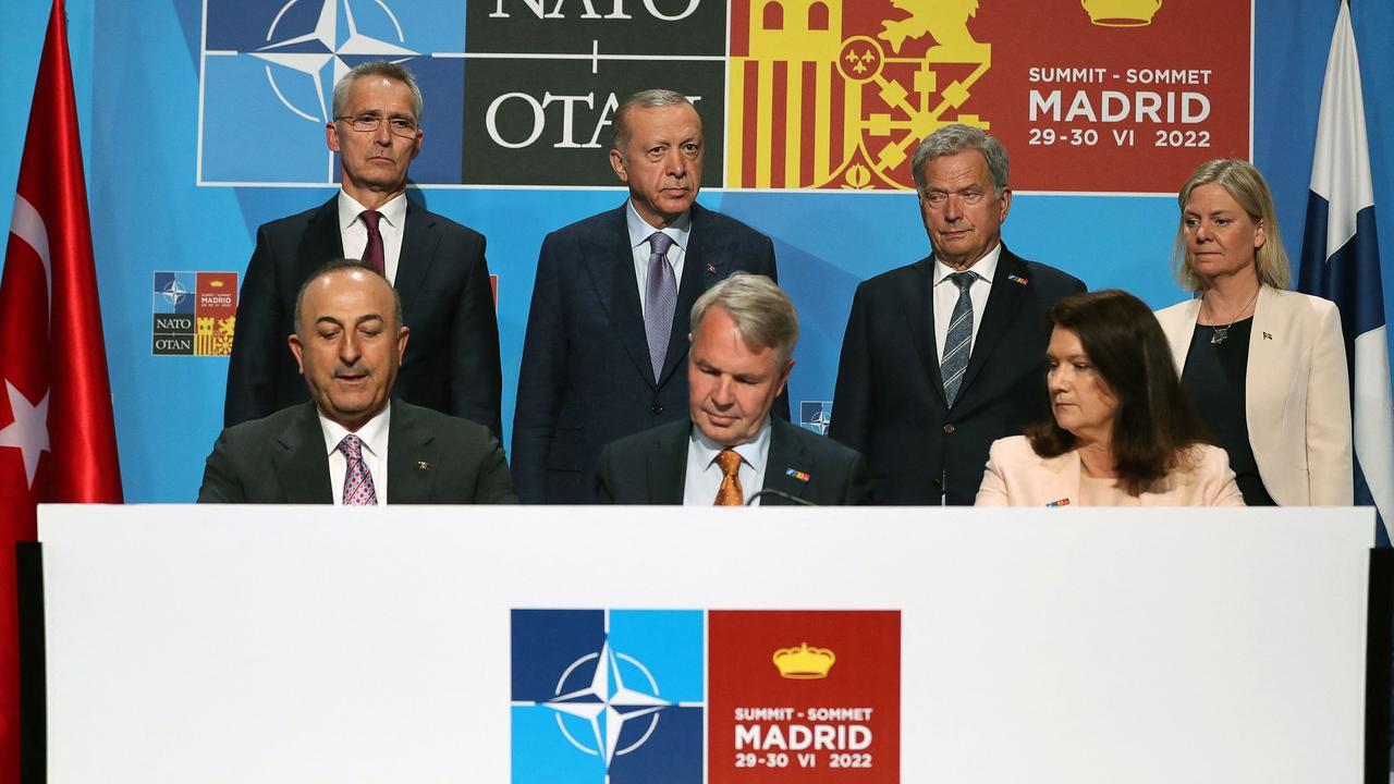 (Back, from left) NATO Secretary-General Jens Stoltenberg, Turkey's President Recep Tayyip Erdogan, Finland's President Sauli Niinisto and Sweden's Prime Minister Magdalena Andersson and (front, from left) Turkish foreign minister Mevlut Cavusoglu, Finnish Foreign Minister Pekka Haavisto, Swedish Foreign Minister Ann Linde signing a memorandum during a NATO summit in Madrid. Picture: Cetin Muhurdar/Turkish Presidential Press Service/AFP