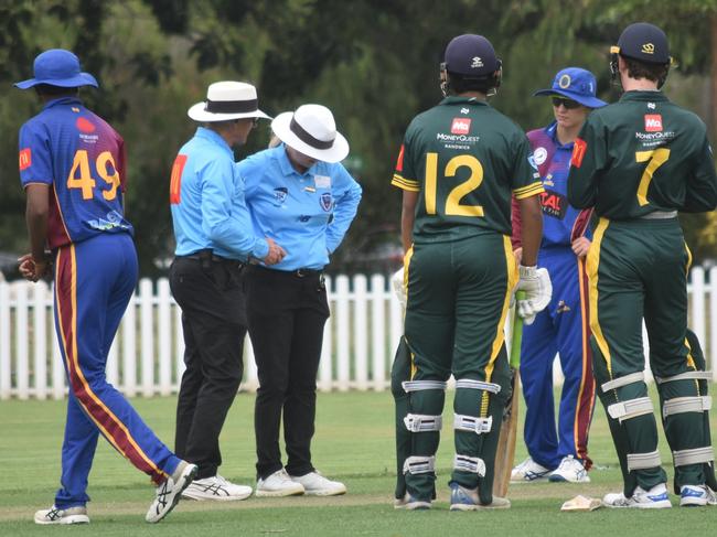 The umpires look closely at the pitch. Picture: Sean Teuma