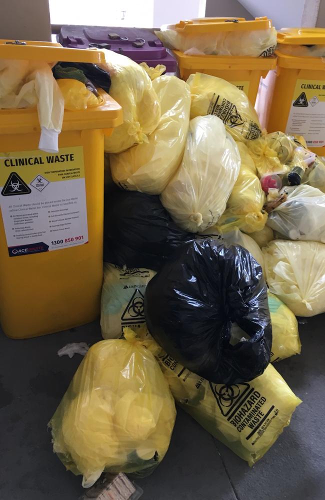 Bags of Covid-19 waste out the back of the Jeta Gardens aged care facility which is Queensland's deadliest nursing home.