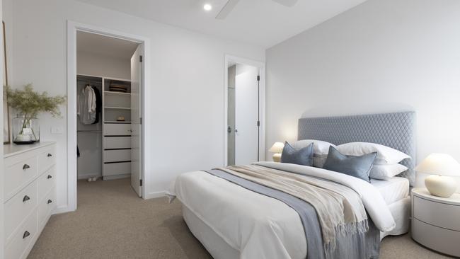 The main bedroom offers a private haven with a walk-in wardrobe and ensuite.