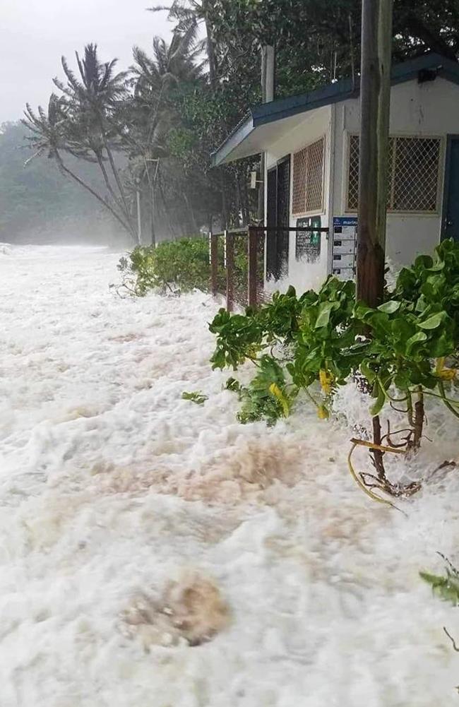 A wave crashes into the lifeguard booth at Trinity Beach. Picture: Patricia Breuil