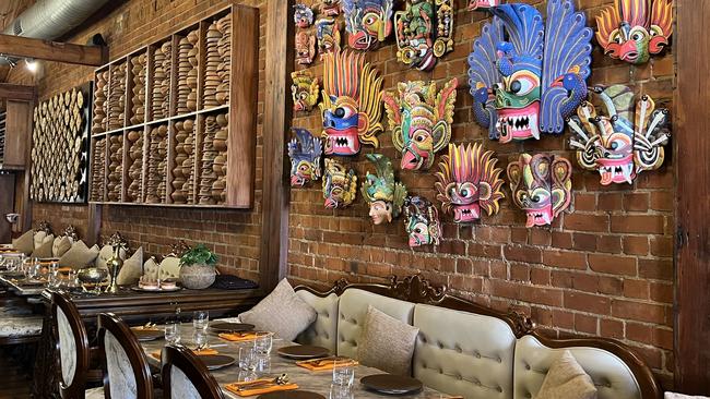 Painted masks and interior at Taprobane Sri Lankan restaurant in Unley