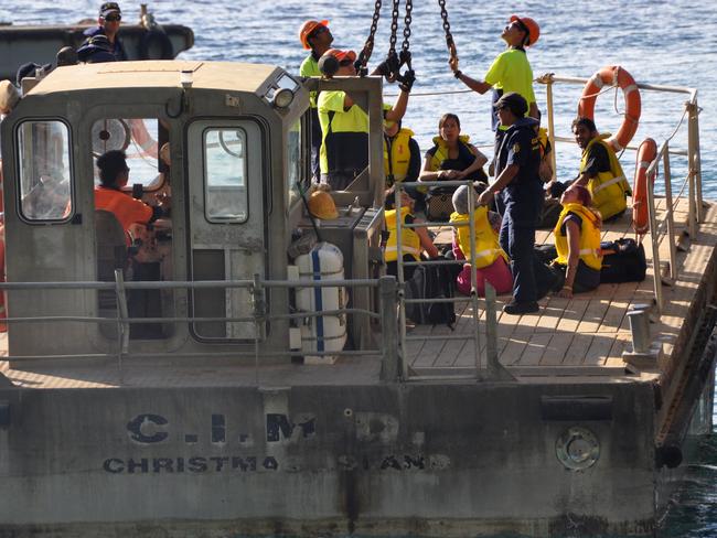 Asylum seekers arrive by boat on Christmas Island. Picture: AAP Image/Josh Jerga