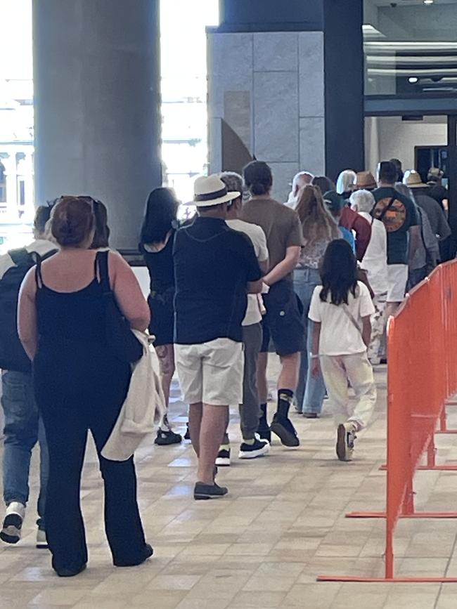 Long lines wait to access the skydeck at Queen's Wharf on Friday