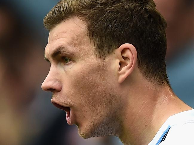 LIVERPOOL, ENGLAND - MAY 03: Edin Dzeko of Manchester City celebrates scoring his team's second goal during the Barclays Premier League match between Everton and Manchester City at Goodison Park on May 3, 2014 in Liverpool, England. (Photo by Laurence Griffiths/Getty Images)